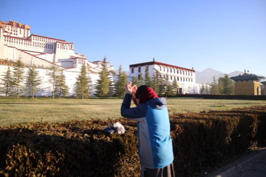 Worshipper in front of  Potala Palace